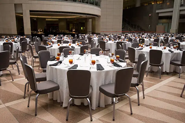 Photo of Large Room Set Up for a Banquet, Round Tables