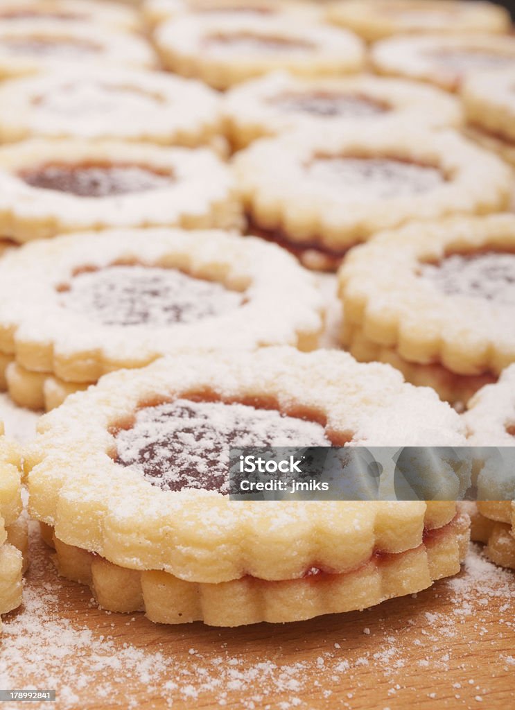 Linz cookies Closeup of Traditional Linzer Cookies on Wooden Board Cake Stock Photo