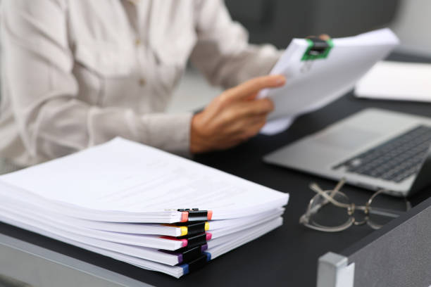 istock Businesswoman working at table in office, focus on documents. Space for text 1789934518
