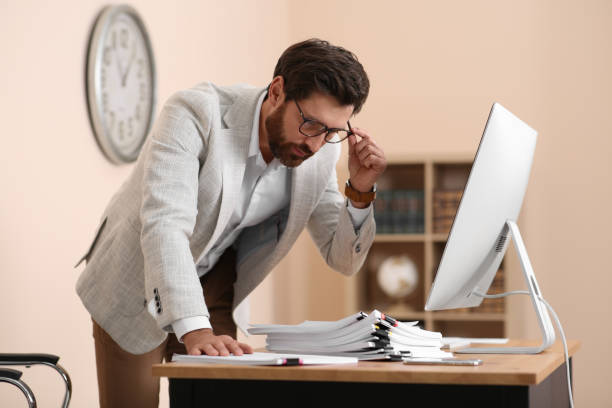 istock Businessman working with documents at wooden table in office 1789935082