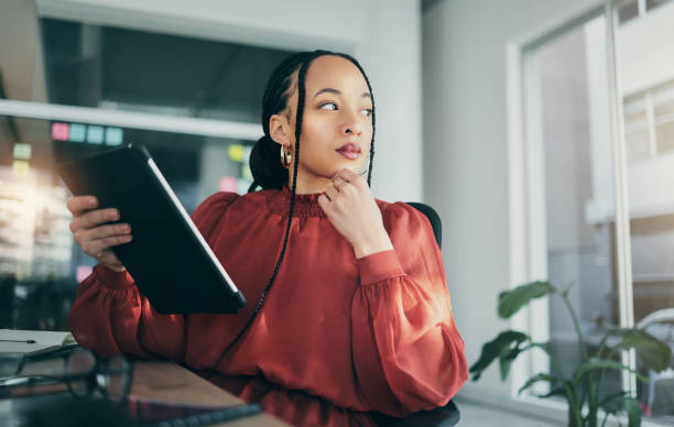 istock Office, tablet and thinking business woman planning, brainstorming and working on ideas, research or project. App designer, problem solving and professional person wonder about development plan 1789938247