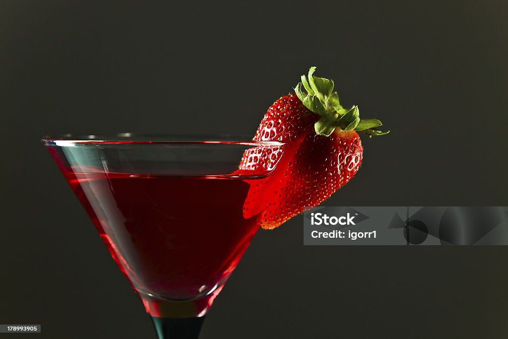 cocktail with strawberry cocktail with strawberry , focus on a berry Alcohol - Drink Stock Photo