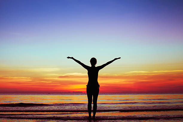 istock silhouette of woman at sunset 178994216