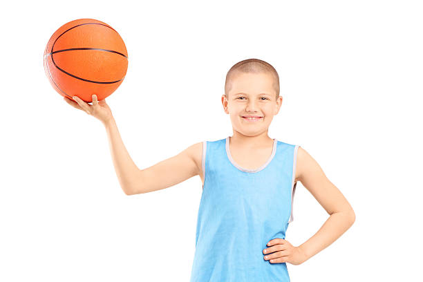 istock Smiling child holding a basketball 178994608