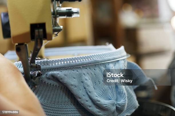 Image Of Machine Knitting Blue Childrens Cap Stock Photo - Download Image Now - Knitting, Machinery, Activity