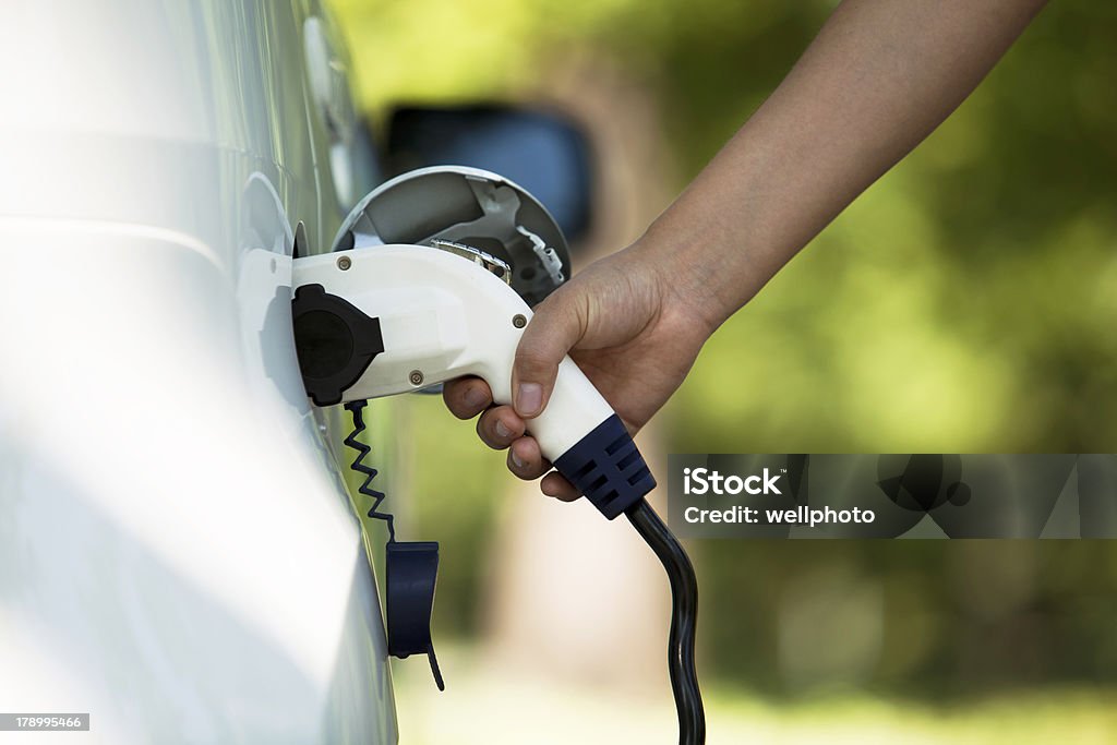Charging battery of an electric car - Royalty-free Şarj Etme Stok görsel