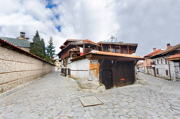 istock old architecture houses and stone paved road, Bansko, Bulgaria 178996316