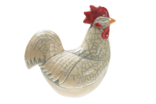 Rooster Figurine on White Background