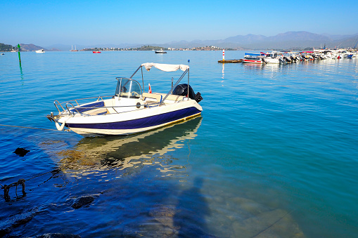 Boat on the beach. Seaside in Fethiye district of Muğla province in Türkiye.