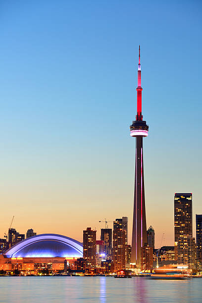 Toronto skyline Toronto sunset over lake panorama with urban skyline. toronto stock pictures, royalty-free photos & images