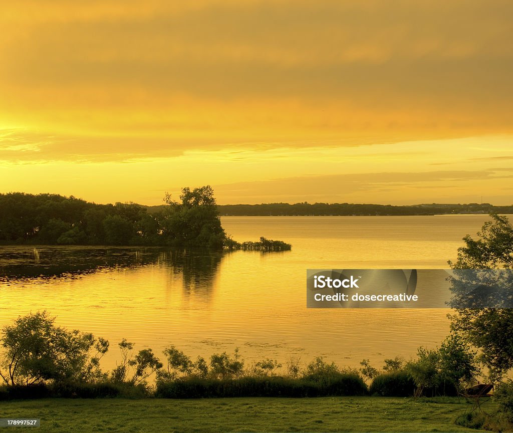 Lake Okoboji at Sunrise Lake Okoboji at Sunrise in Iowa During the Summer. Cold Drink Stock Photo