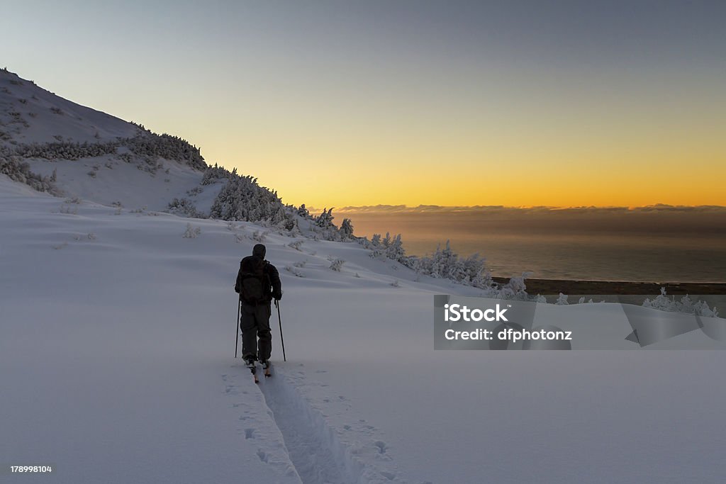 Ski Touring Sunrise start to an epic day, In the mountains, fresh snow with a blue bird sky. Location Kaikoura, New Zealand. Leading Stock Photo