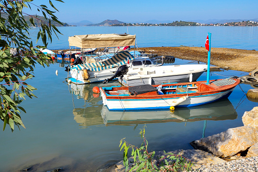 Boat on the beach. Seaside in Fethiye district of Muğla province in Türkiye.