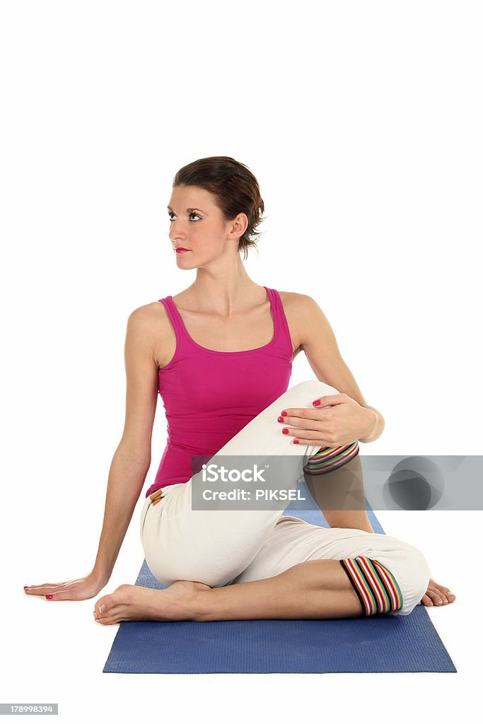 Frau sitzen in Yoga-Pose hat an der Seite - Lizenzfrei Aktivitäten und Sport Stock-Foto