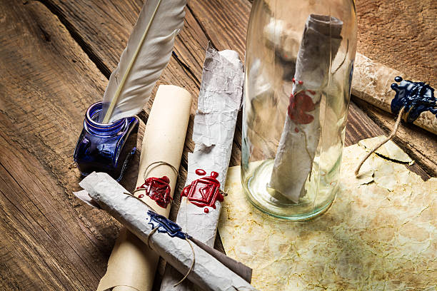 istock Preparing to send ancient letter in a bottle with ink 178998615
