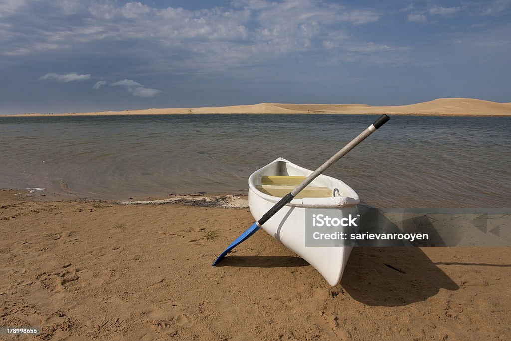 Canoe at Kasouga estuary Eastern Cape South Africa Canoe and paddle at the Kasouga River mouth Beach Stock Photo