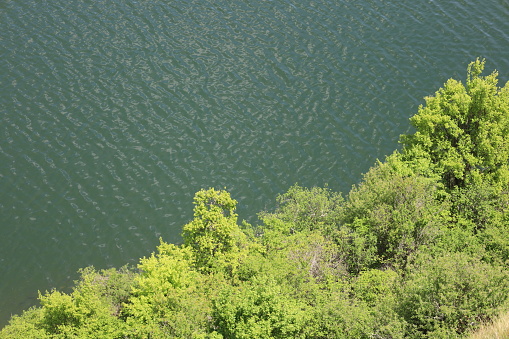 woman doing hike around lake