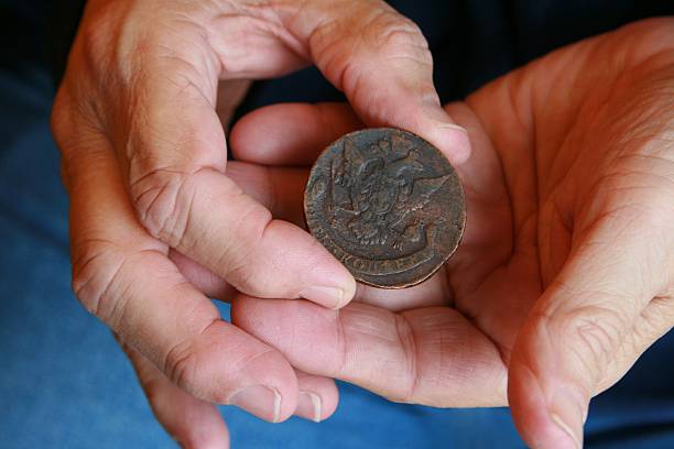 istock Man's Hands Holding Antique Coin 179000007