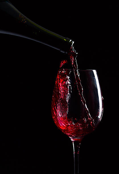 istock bottle and glass with red wine 179000151