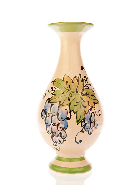 Vase ornate with blue grapes stock photo