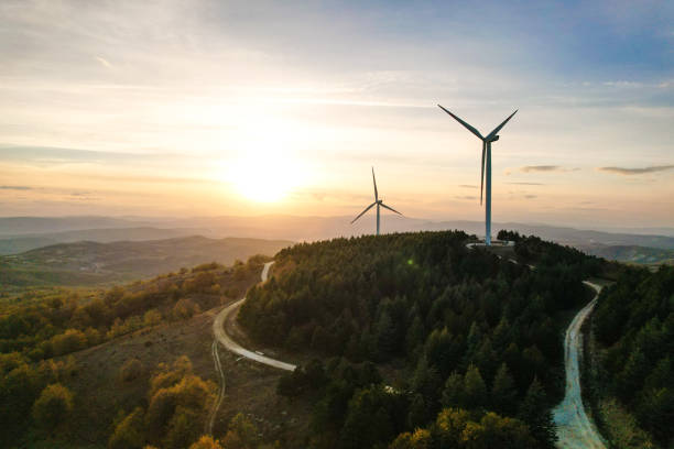 istock Wind turbines and solar panels in the forest area 1790006099