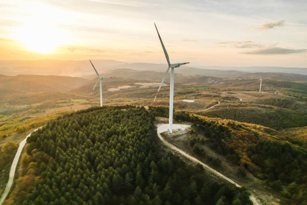 istock Wind turbines and solar panels in the forest area 1790008740
