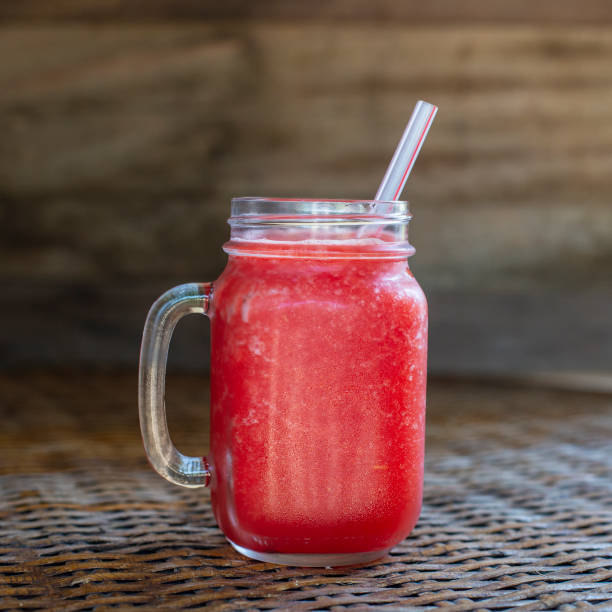 istock Fresh organic watermelon smoothie in glass mug on table 1790009837