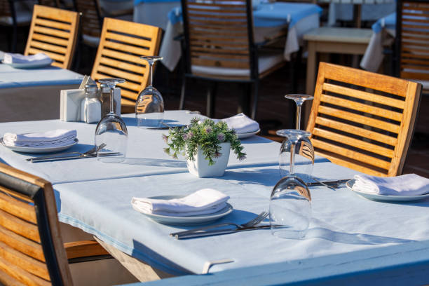 istock Elegant table setting with fork, knife, wine glass and napkin in restaurant 1790009862
