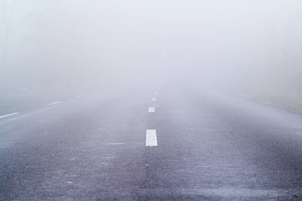 istock Asphalt road in an autumn fog 179001330