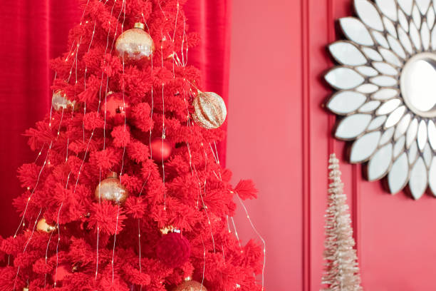 istock Red Christmas tree with golden decorations 1790017895