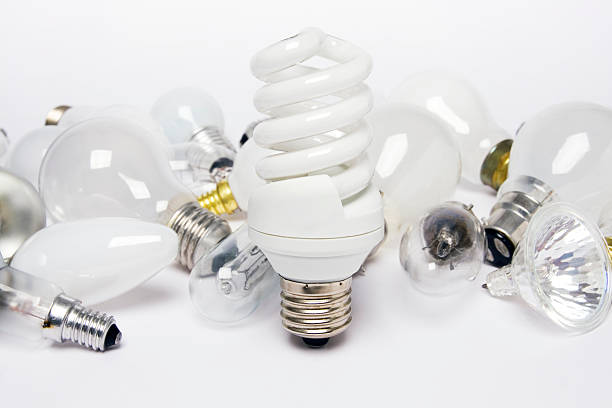 risparmio energetico lampadina e lampadine standard - recycled bulb foto e immagini stock