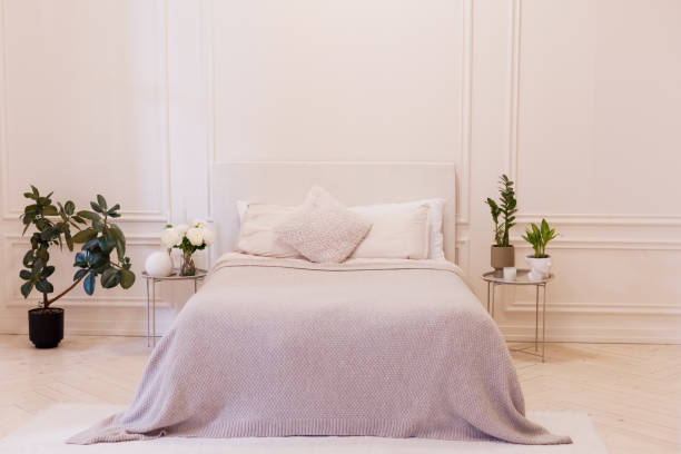 istock Light bedroom with white walls 1790020109