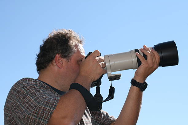 istock Photographer with a big lens 179003052