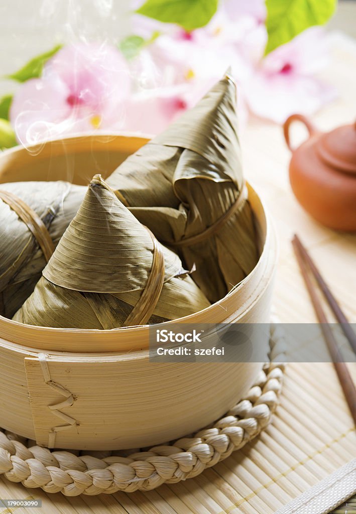 Chinese food rice dumpling Hot rice dumpling or zongzi. Traditional steamed sticky  glutinous rice dumplings. Chinese food dim sum. Asian cuisine. Asian Culture Stock Photo