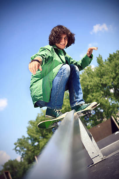 istock boy skateboarding at a park 179004496