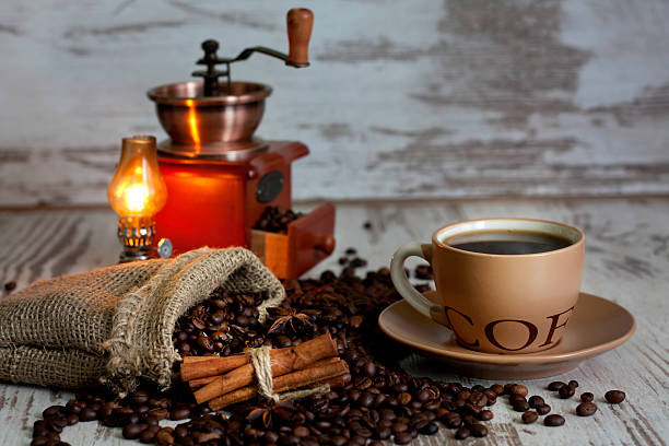 istock Cup of coffee with grinder in night 179005057