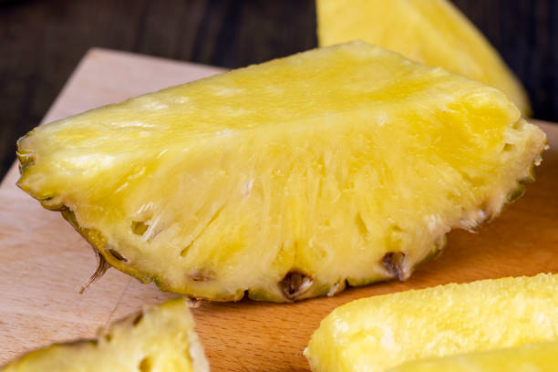 istock ripe yellow pineapple cut into pieces 1790052313