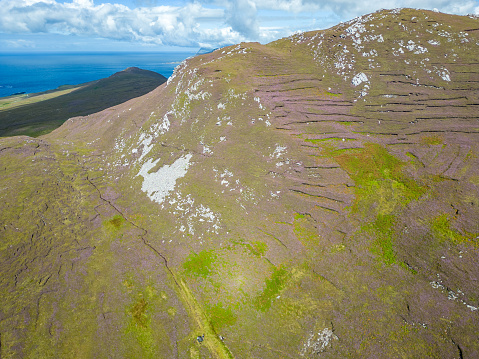Aerial view of Granuaile Loop Walk Trail cover by rocks, flowers and vegetation, Derreen, Achill island, Mayo, Ireland