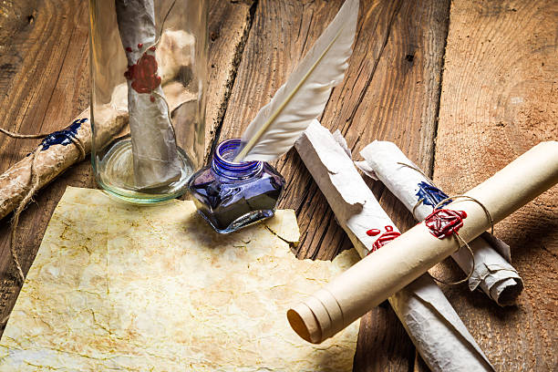 istock Writing ancient feather letter and send it in a bottle 179007441