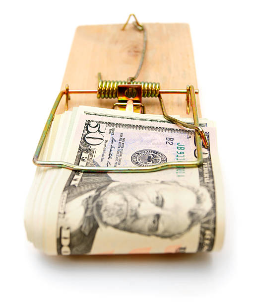 istock Money in mousetrap. On white. 179007452