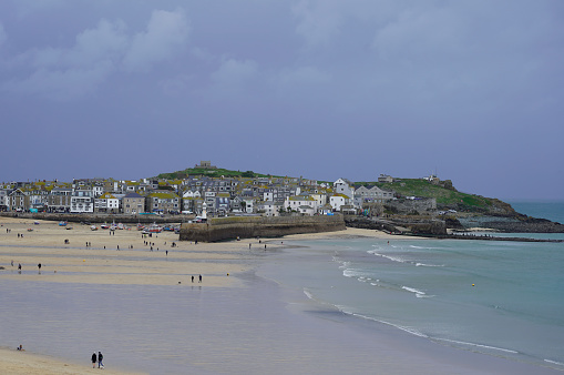St Ives harbor during low tide, overcast, dramatic sky