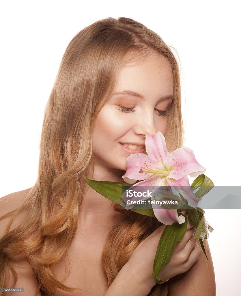 Portrait of young woman  with lily Close up portrait of beautiful young woman face with lily Adult Stock Photo