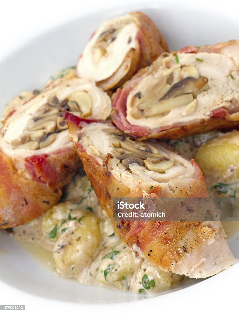 Chicken Roulade Chicken bacon roulades, chicken breasts, pounded thin, stuffed with bacon, shallots, and Parmesan, rolled up, browned, roasted, then served sliced on gnocchi Chicken Meat Stock Photo