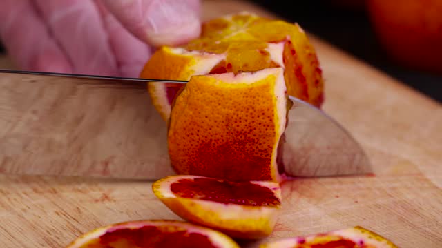 cut fresh and sweet red orange , close up