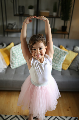 Girl performing ballet dance at home