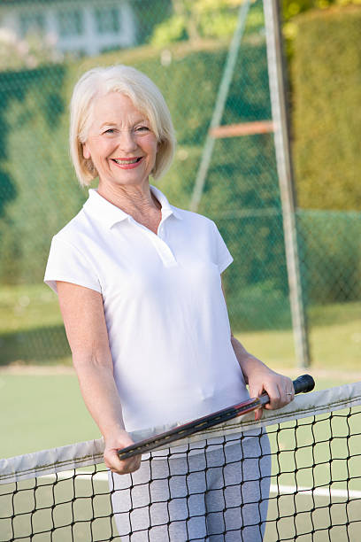 istock Woman playing tennis and smiling 179010946