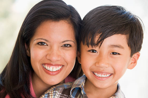 istock Woman and young boy smiling 179011820
