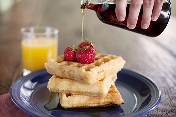 istock Breakfast with waffles, strawberries and orange juice 179012882
