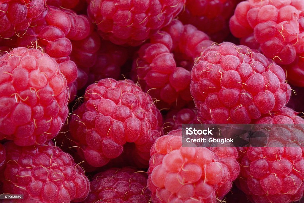 Raspberries background Closeup on fresh, red raspberries, sweet fruits background Close-up Stock Photo