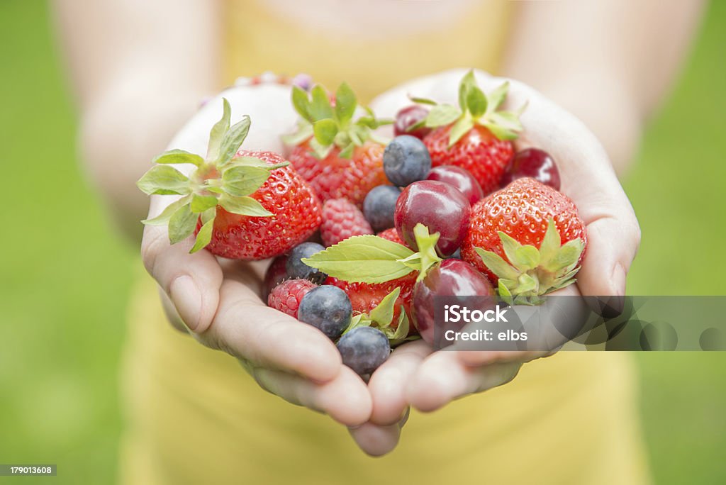 girl holding fruits "young girl holding fruits in heart shape, ultra high resolution" Fruit Stock Photo